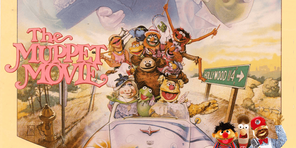Muppet characters in a car from The Muppet Movie, colorful and lively scene.